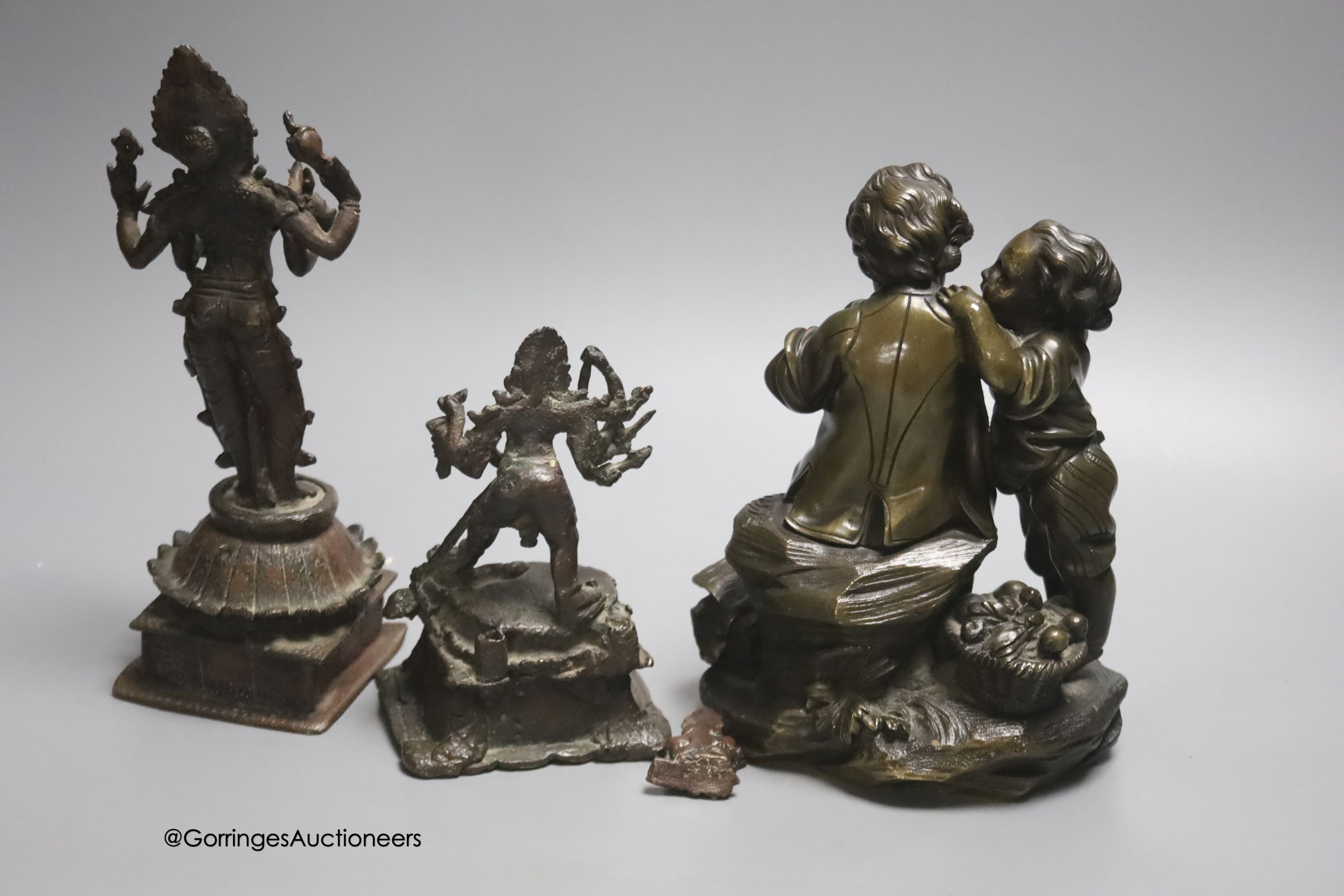 A bronze group of two children and two Indian bronze figures, tallest 20cm